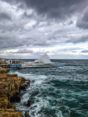 The Sliema Pitch hit by a large wave in Sliema, Malta.