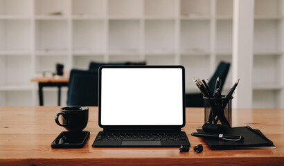 Computer Laptop with blank screen on table of coffee shop blur background with bokeh, desk blank work office mockup monitor