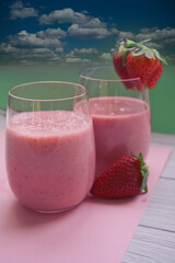 refreshing strawberry smoothie on a beach background in summer
