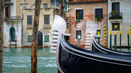 Fototapeta na wymiar Gondola on Canal Grande close view of metallic rostrum symbol of Venice, Italy
