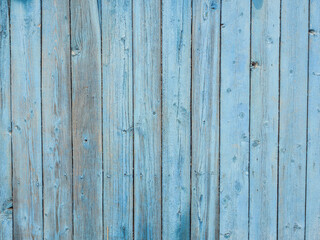 Naklejka premium Old wooden planks painted with peeling blue paint.