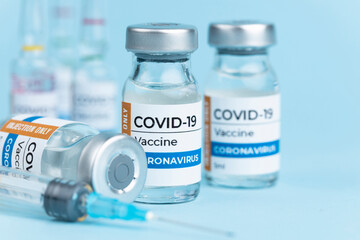Coronavirus Covid-19 Vaccine vial glass bottles and syringe.