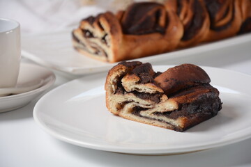 Babka or Brioche Bread. Stuffed with hazelnut cream. Traditional Jewish bread-like cake swirled with chocolate or cinnamon and topped with nuggets of cinnamon-sugar streusel.