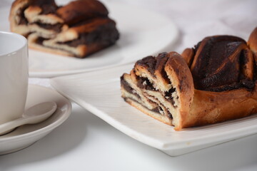 Babka or Brioche Bread. Stuffed with hazelnut cream. Traditional Jewish bread-like cake swirled with chocolate or cinnamon and topped with nuggets of cinnamon-sugar streusel.