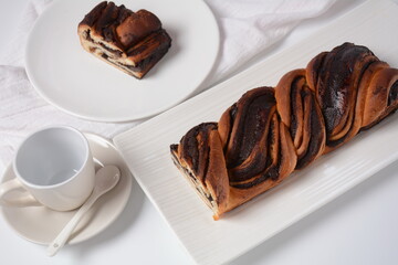 Babka or Brioche Bread. Stuffed with hazelnut cream. Traditional Jewish bread-like cake swirled with chocolate or cinnamon and topped with nuggets of cinnamon-sugar streusel.
