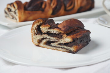 Babka or Brioche Bread. Stuffed with hazelnut cream. Traditional Jewish bread-like cake swirled with chocolate or cinnamon and topped with nuggets of cinnamon-sugar streusel.