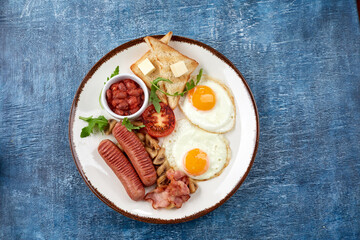 traditional breakfast with egg and sausages