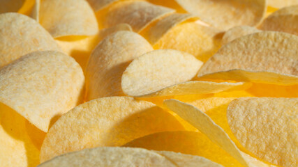 Crispy original potato chips background