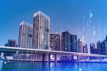 Obraz premium Skyscrapers of Dubai business downtown. International hub of trading and financial services of Western Asia. FOREX graph and chart concept. Double exposure. Dubai Canal waterfront.