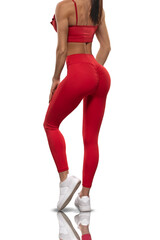 legs girl in red leggings and a top stay back on a white background