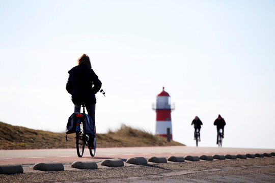 People biking near West Kapelle, Zeeland, The Netherlands