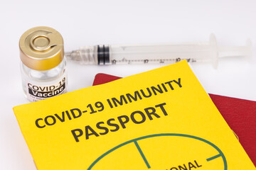 Concept of Covid-19 Immunity Passport for travel with vial and syringe