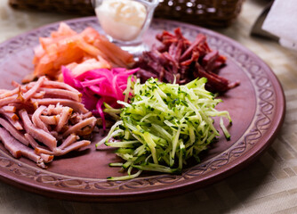 traditional Belarusian salad of vegetables and bacon. salad Paparats kvetka