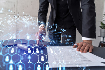 HR specialist researching and analyzing the data of salary on employment market to forecast ongoing expenses of the company using calculator. Hiring new talented officers. Social media hologram icons