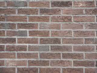 Texture of a gray brick wall.