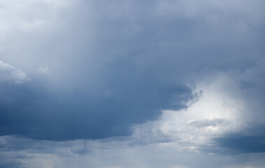 Fototapeta premium Majestic rain clouds and light through their.