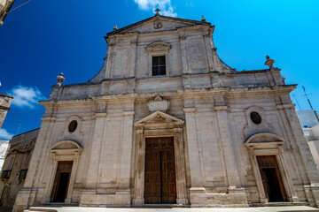 Fototapeta na wymiar Church front façade. Mesagne. Puglia, Italy under the clear blue sky of a sunny summer day, travel photography, street view.