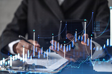 African American businesswoman in formal wear is signing the contract to invest money in stock market. Internet trading and wealth management. Checking the details of transaction at smart phone. Forex