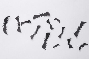 Paper-cut black bats on a black background. Halloween, Horror, creepy background