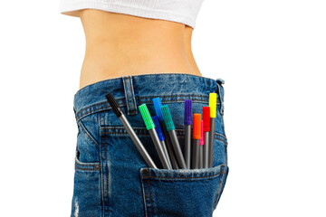Slim body in blue jeans with colored felt tip pen in the pocket, isolated