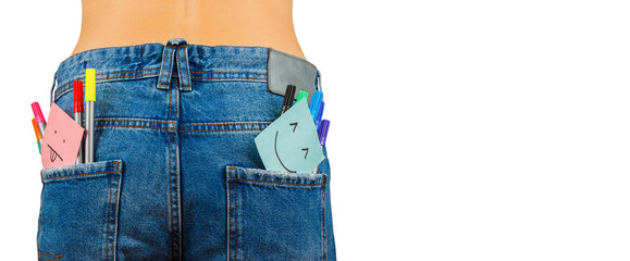 Slim body in blue jeans with colored felt tip pen in the pocket
