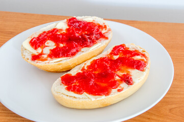Sandwiches with butter and strawberry jam.