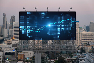 Glowing FOREX graph hologram on billboard, aerial panoramic cityscape of Bangkok at sunset. Stock and bond trading in Southeast Asia. The concept of fund management.