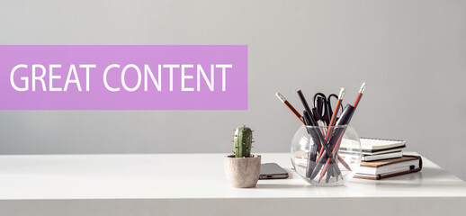 GREAT CONTENT – text on the background of the office table. Business concept.
