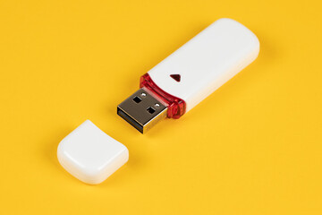 USB flash drive on yellow background