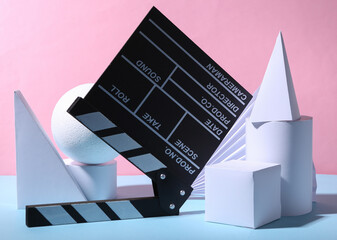 Movie clapperboard and geometric shapes on a blue-pink pastel background. Concept art