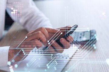 Programmer holding in the hands a smart phone and testing an innovative application to provide a completely new service. Close up shot. Hologram tech graphs. Concept of Dev team. Formal wear.