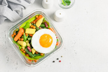 Meal preparation, fitness, clean eating, egg vegetables in glass container. Space for text, top view.