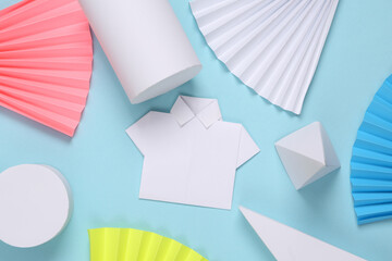 Origami shirt on abstract background with geometric shapes. Minimalism. Concept art. Creative layout