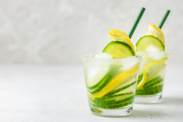 Refreshing lemon cucumber summer iced drinks. Space for text.