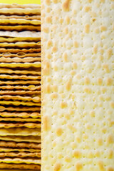 Matza sheets on a round stand on a wooden table. copy space.