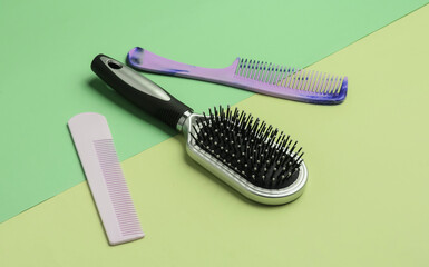 Combs on pastel background. Beauty minimalistic concept. Hair care. Top view