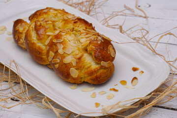 plaited yeast bun-pastry on vintage table