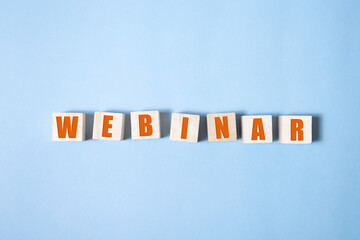 WEBINAR word on wooden cubes ob blue background