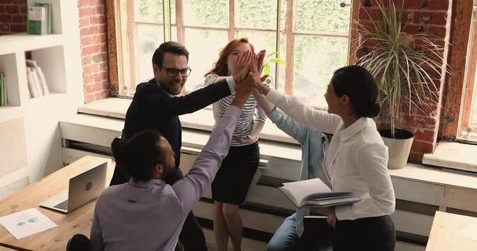 After speech boss and group of diverse staff members give high five, motivate team to success, encourage subordinates before important meeting, express gratitude for work done. Teamwork, unity concept