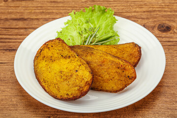 Baked potato with herbs and spices