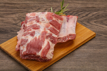 Raw pork ribs served rosemary