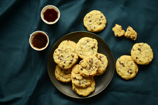 Delicious chocolate chips cookies on plate top view