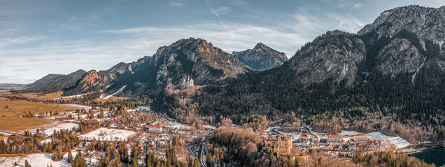 Aerial panorama drone shot of Hohenschwangau in Fussen with view of Neuschwanstein castle in Germany winter