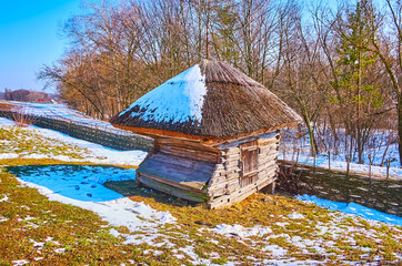 The timber playpen with a straw roof, Pyrohiv Skansen, Kyiv, Ukraine