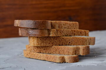slices of black bread, stacked on top of each other like a pyramid