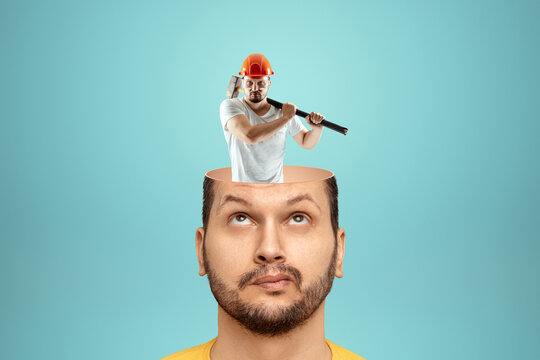 The man has a man in a helmet and a sledgehammer instead of a brain in his head. Concept brain works, tasks for the head.