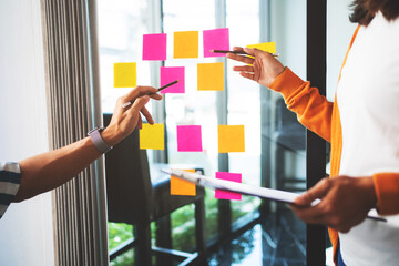 University of College students discussing with assignment in library, Education concept..