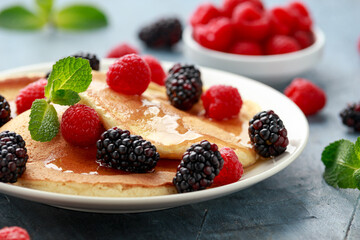 Morning breakfast Pancakes with fresh berry and honey. Healthy food