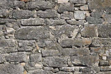 Ancient wall of castle. Old stone wall, grunge textured background. Photo
