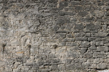 Ancient wall of castle. Old stone wall, grunge textured background. Photo